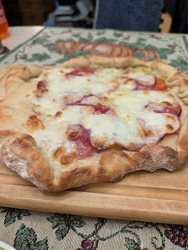 a messy handmade pizza