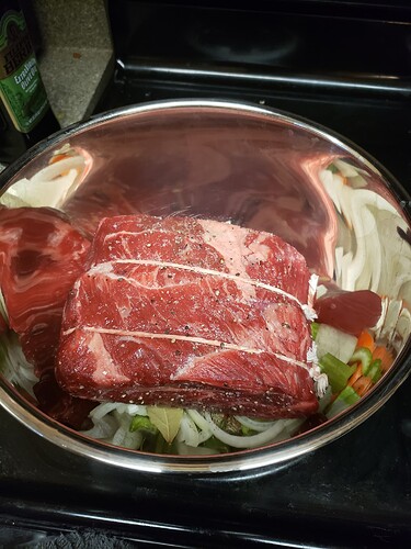 3 lbs of chuck roast beef sitting in a large metal bowl.